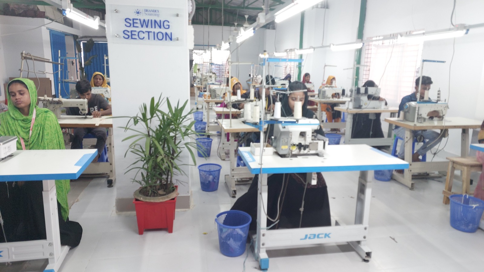 Brandex Sourcing sewing section workers operating JACK sewing machines Bangladesh factory